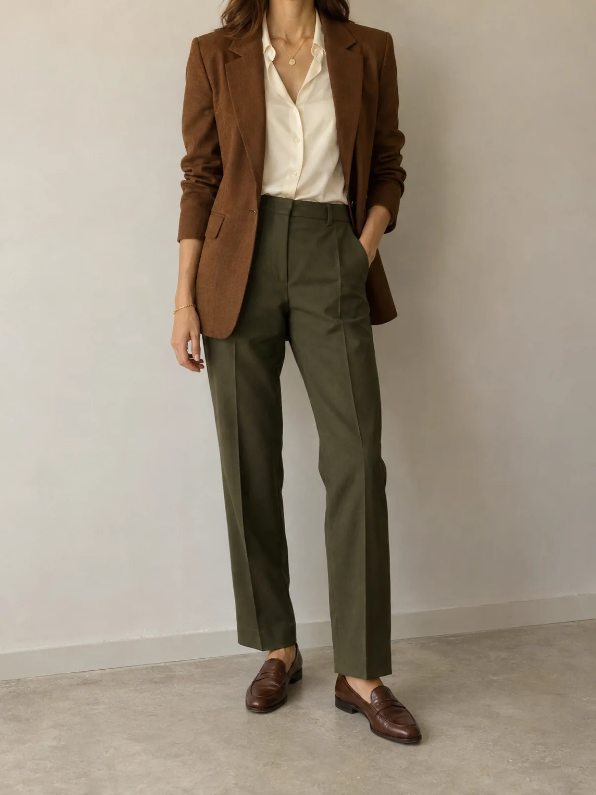 Deep Autumn work outfit: chocolate brown blazer, cream blouse and dark olive trousers with brown leather loafers